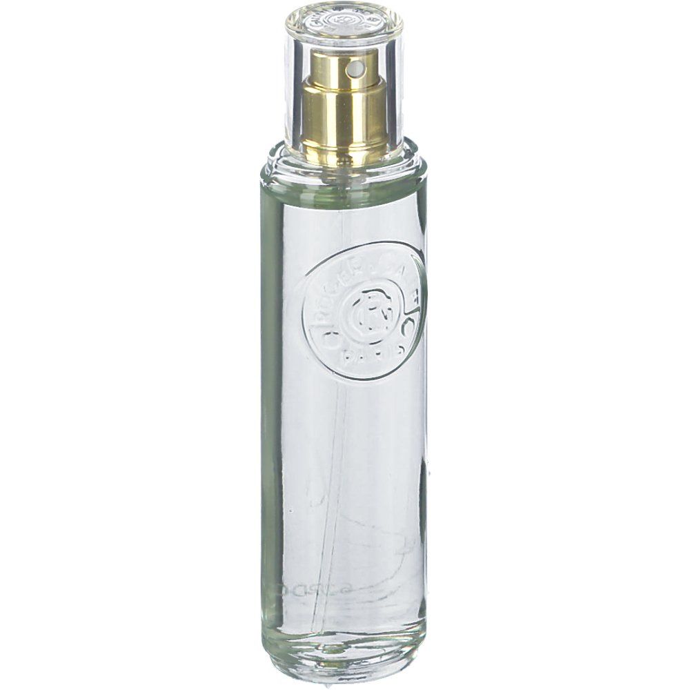 Zylindrische Glasflasche mit Sprühkopf. Klar, mit goldfarbenem Zerstäuber und durchsichtiger Kappe. Geprägtes Logo auf der Vorderseite.