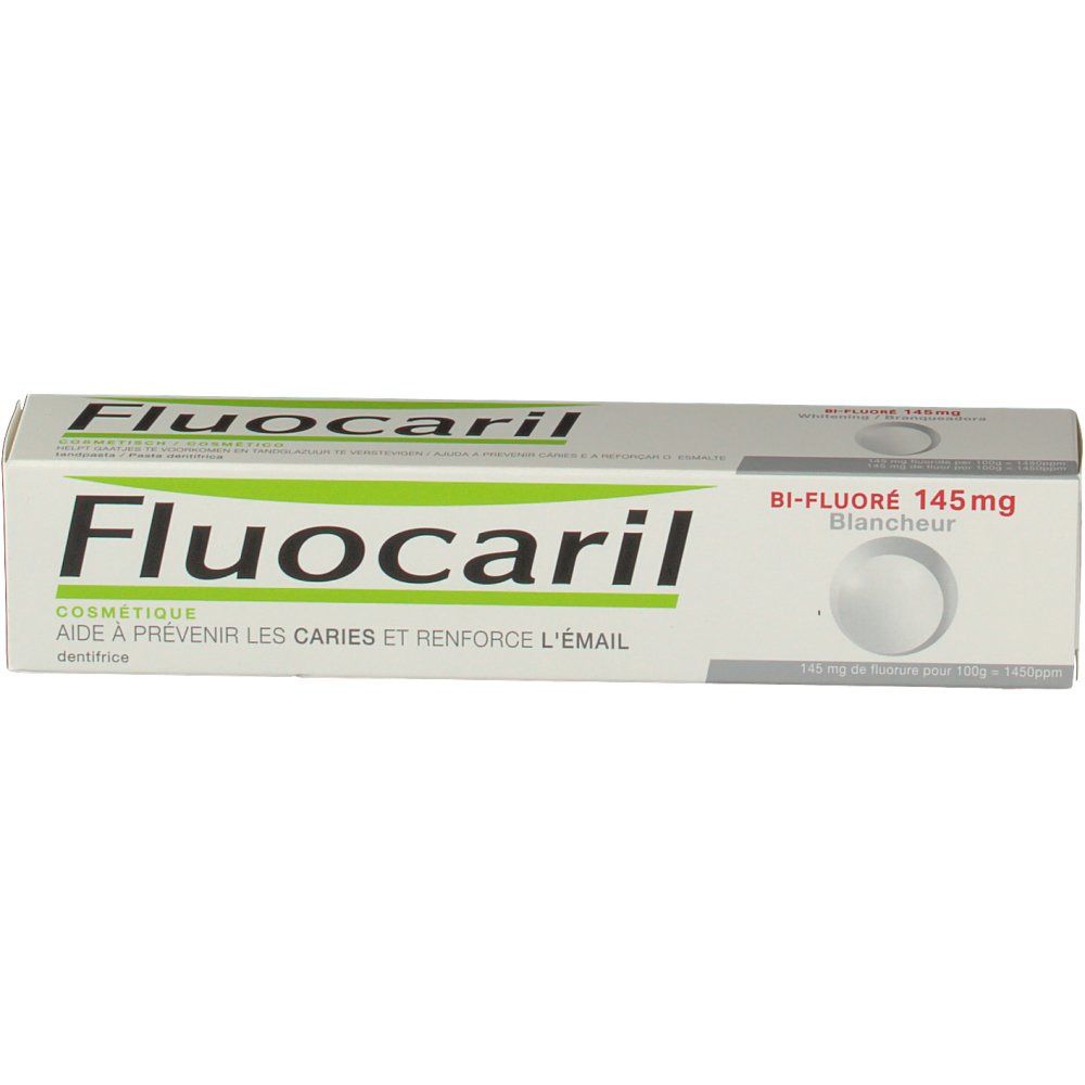 Zahncreme-Schachtel, weiß mit grüner Schrift. Aufschrift Fluocaril. Enthält 145mg Fluorid. Perspektivische Ansicht.