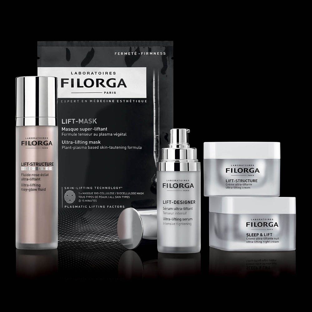 Divers produits FILORGA. Lift-Mask, sérum, crème. Fond noir.