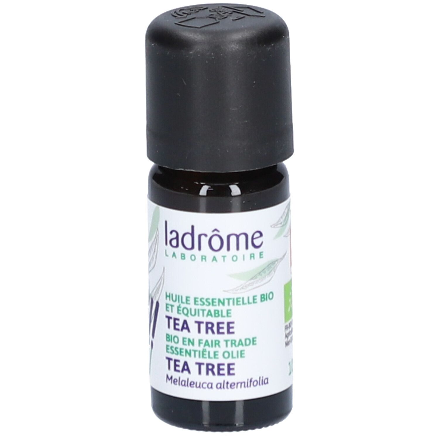 Flacon en verre brun avec bouchon noir. Étiquette avec nom du produit et logo. Inscription : Tea Tree.