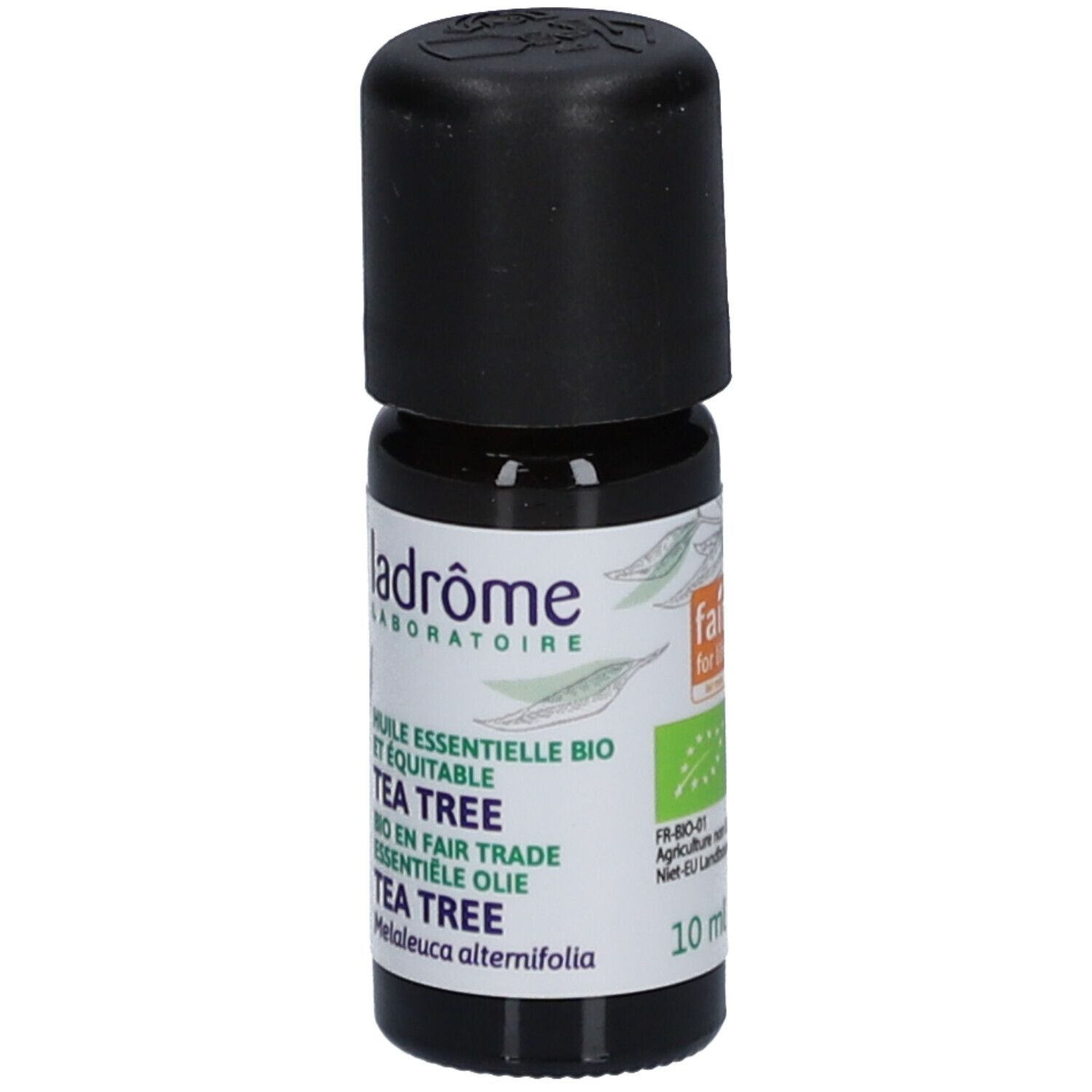 Flacon en verre brun avec bouchon noir. Étiquette avec nom du produit et logo. Inscription : Tea Tree.