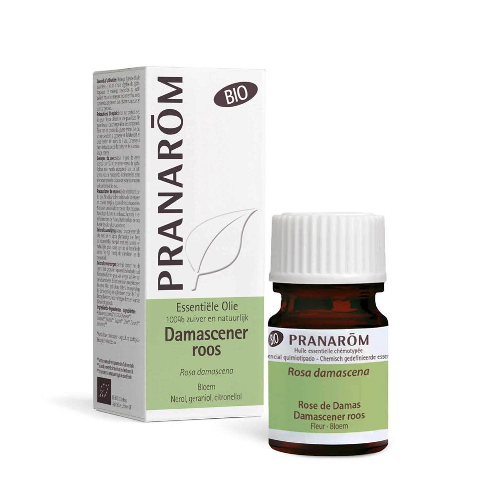 Flacon en verre brun, bouchon blanc. Étiquette: Rosa damascena. Marque: Pranarôm.