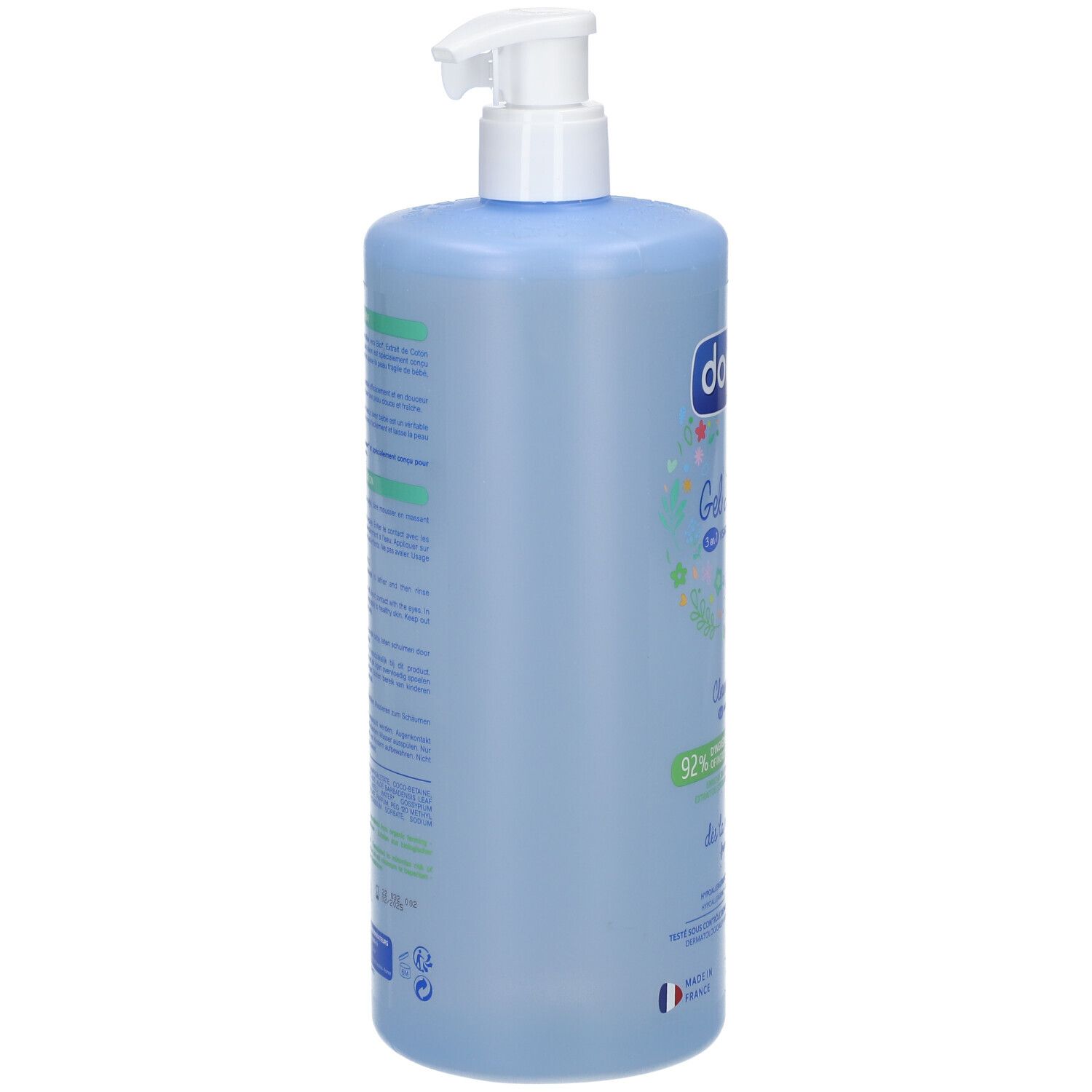 Hellblaue Flasche mit weißem Pumpverschluss. Rückseite mit Text in Grün und Blau. Französische Flagge unten.