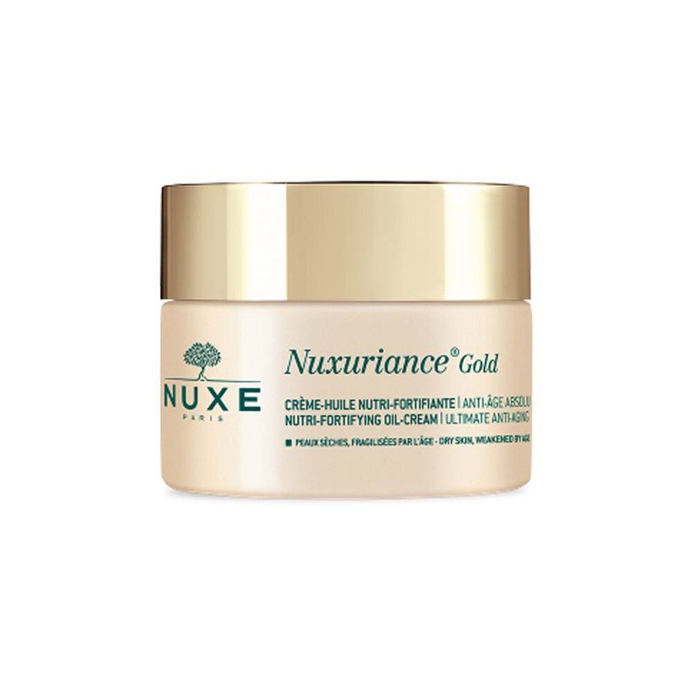 Nuxe Nuxuriance Gold Crème-Huile dans un pot en verre avec un couvercle argenté.