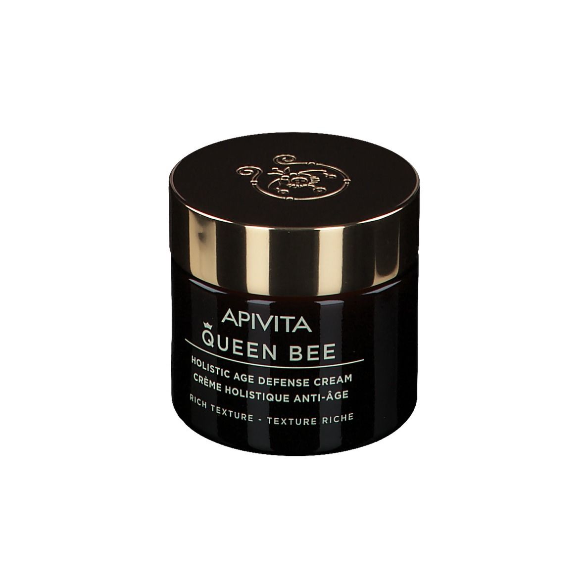 Pot de crème brun foncé avec couvercle doré. Inscription : Apivita Queen Bee, Holistic Age Defense Cream.