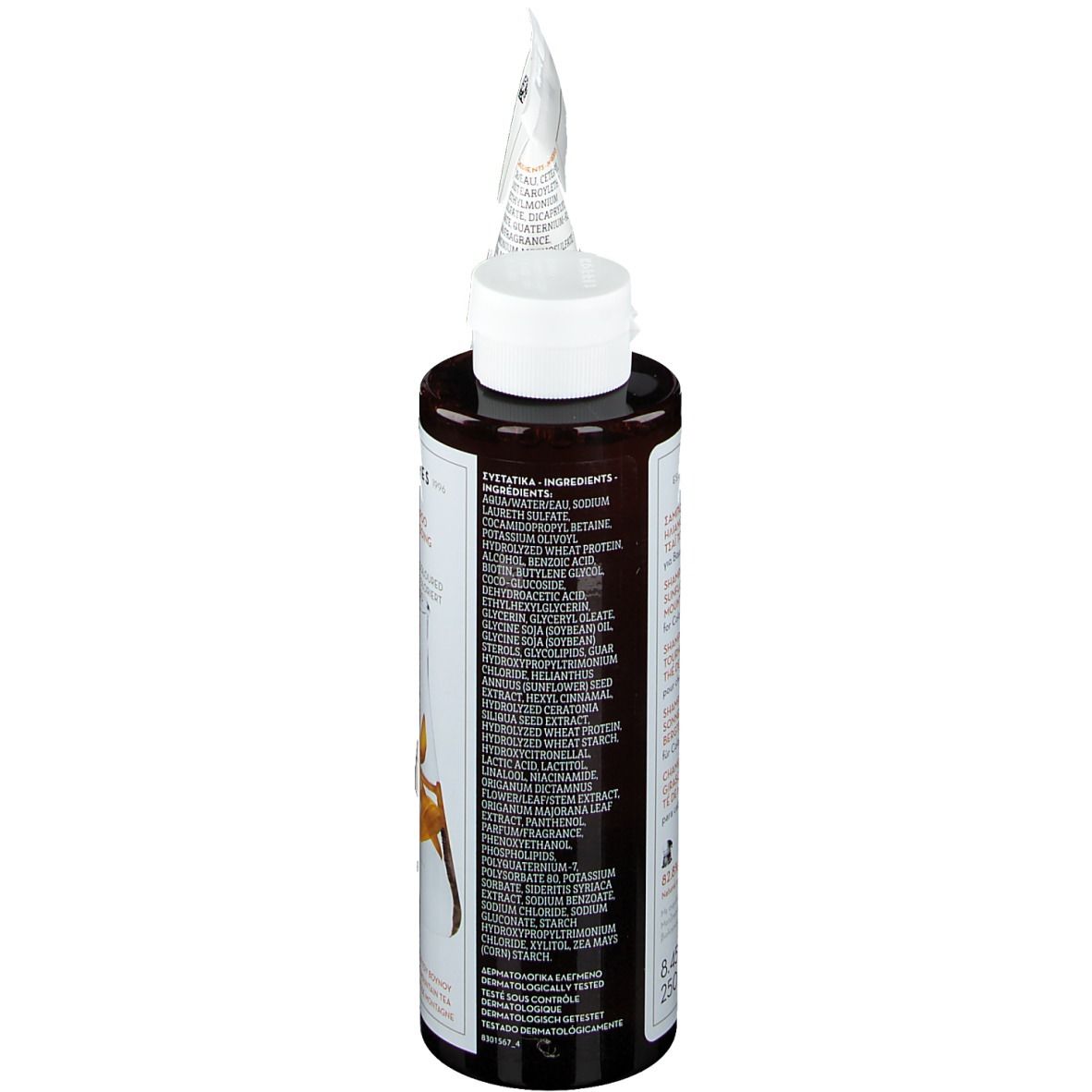 KORRES Shampoo-Flasche. Braune Flasche mit weißem Deckel. Zutatenliste auf der Rückseite.
