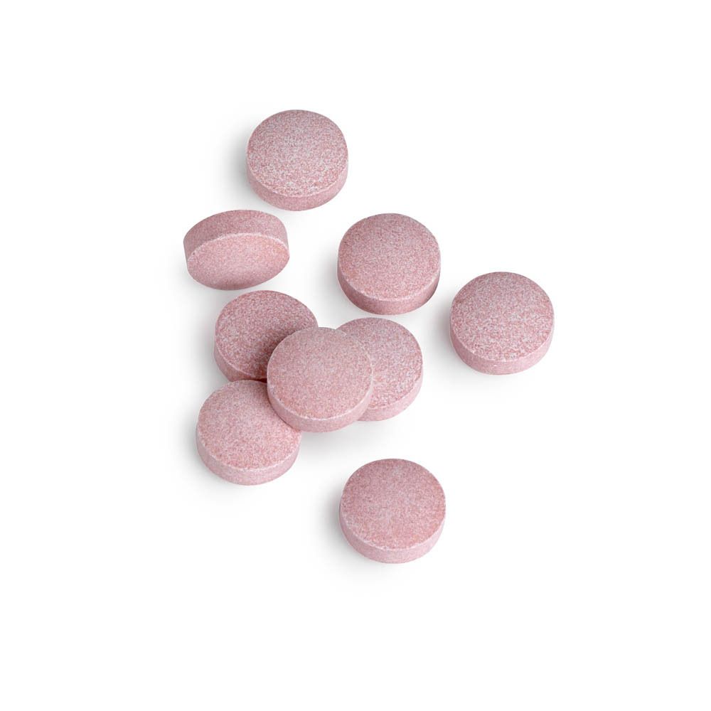 Acht rosa Tabletten. Runde Form. Auf weißem Hintergrund.