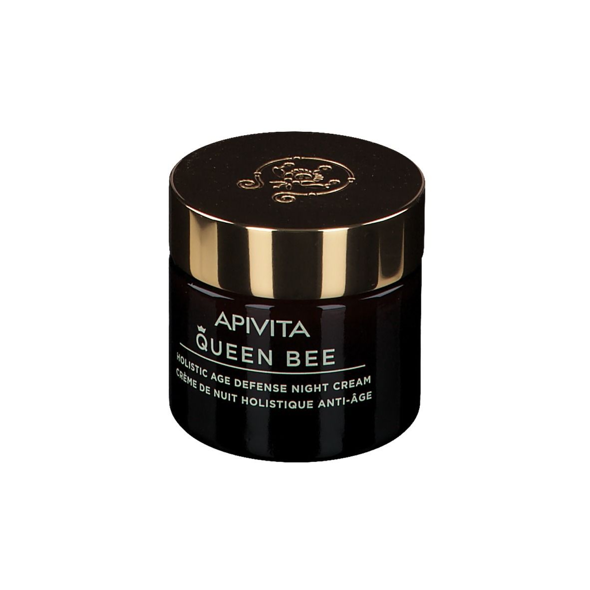 Pot en verre brun foncé avec couvercle doré. Inscription : APIVITA QUEEN BEE, Holistic Age Defense Night Cream.