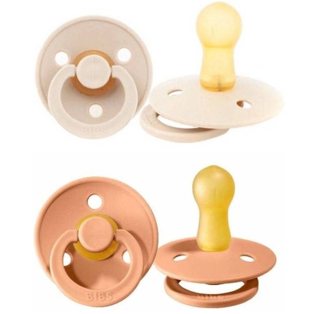 Deux sucettes pêche et vanille. Forme ronde avec tétine et anneau. Logo BIBS visible.