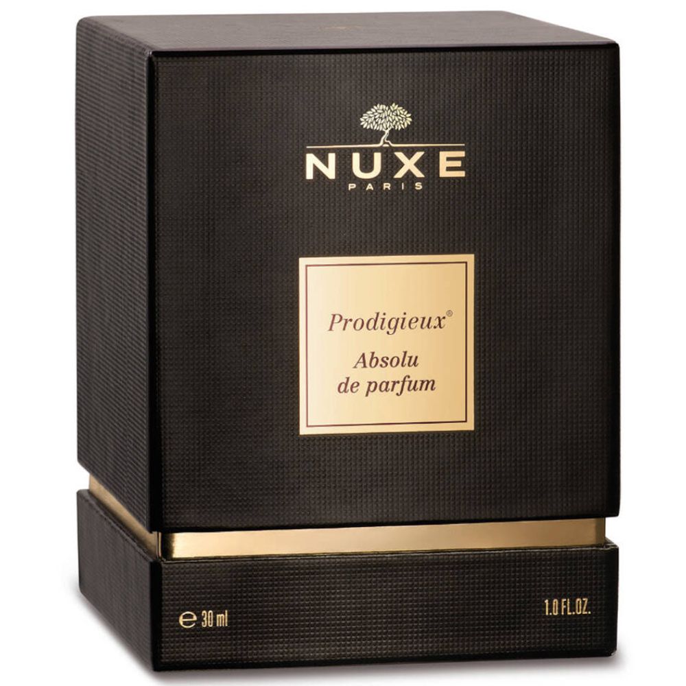 Schwarzer quadratischer Karton mit goldfarbenen Details. Aufschrift: Nuxe Paris, Prodigieux Absolu de parfum.