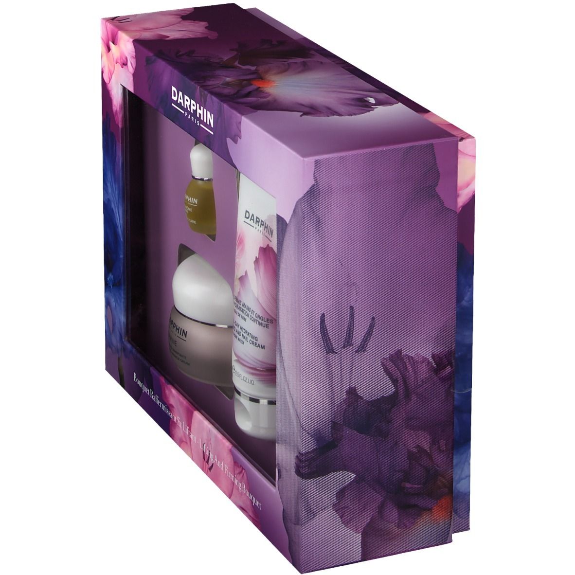 Box-Set mit Produkten. Sichtfenster zeigt Flaschen und Tiegel. Verpackung mit floralem Muster und Markenschriftzug.