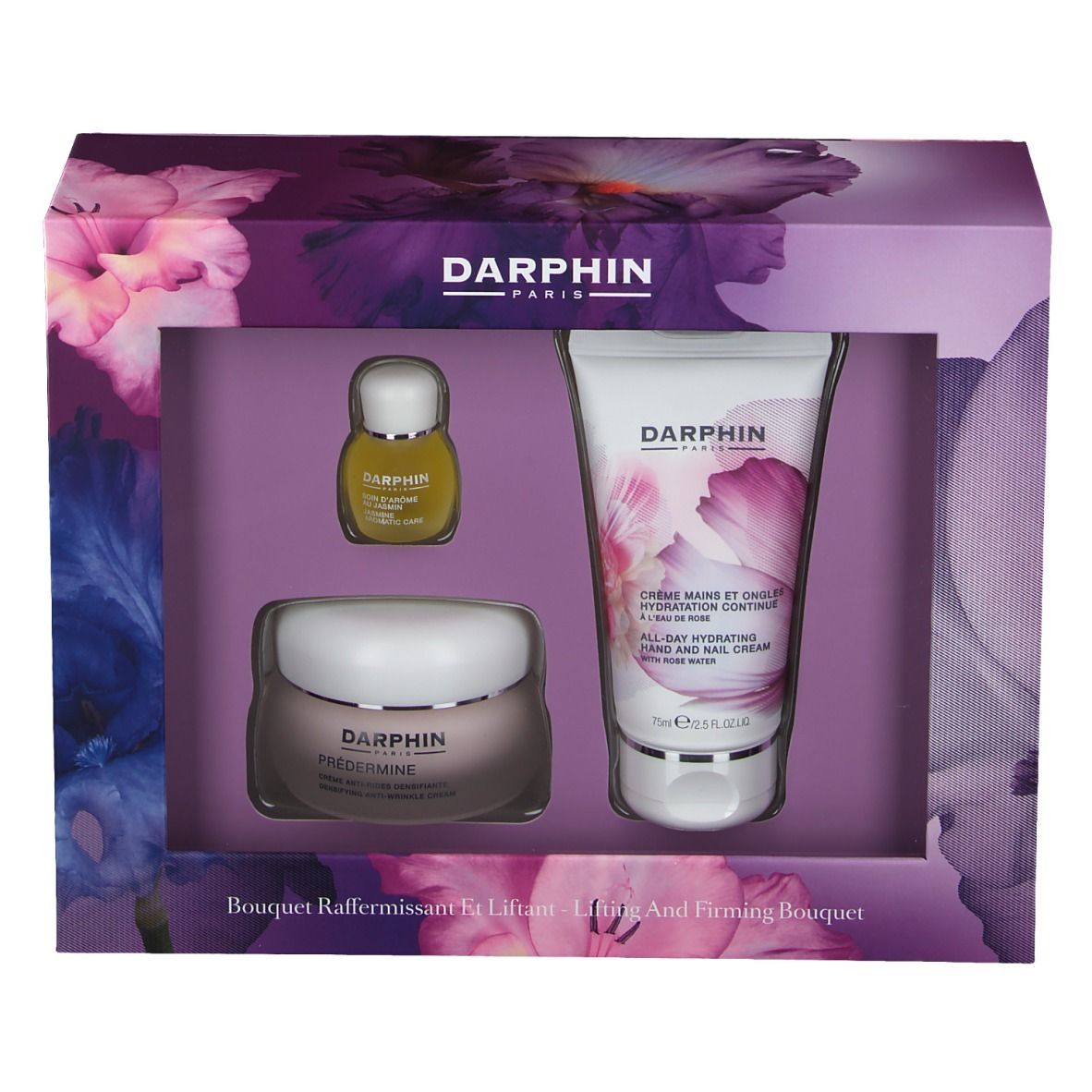 Box-Set mit drei Produkten. Enthält Creme, Serum und Handcreme. Floral bedruckt. Markenschriftzug.