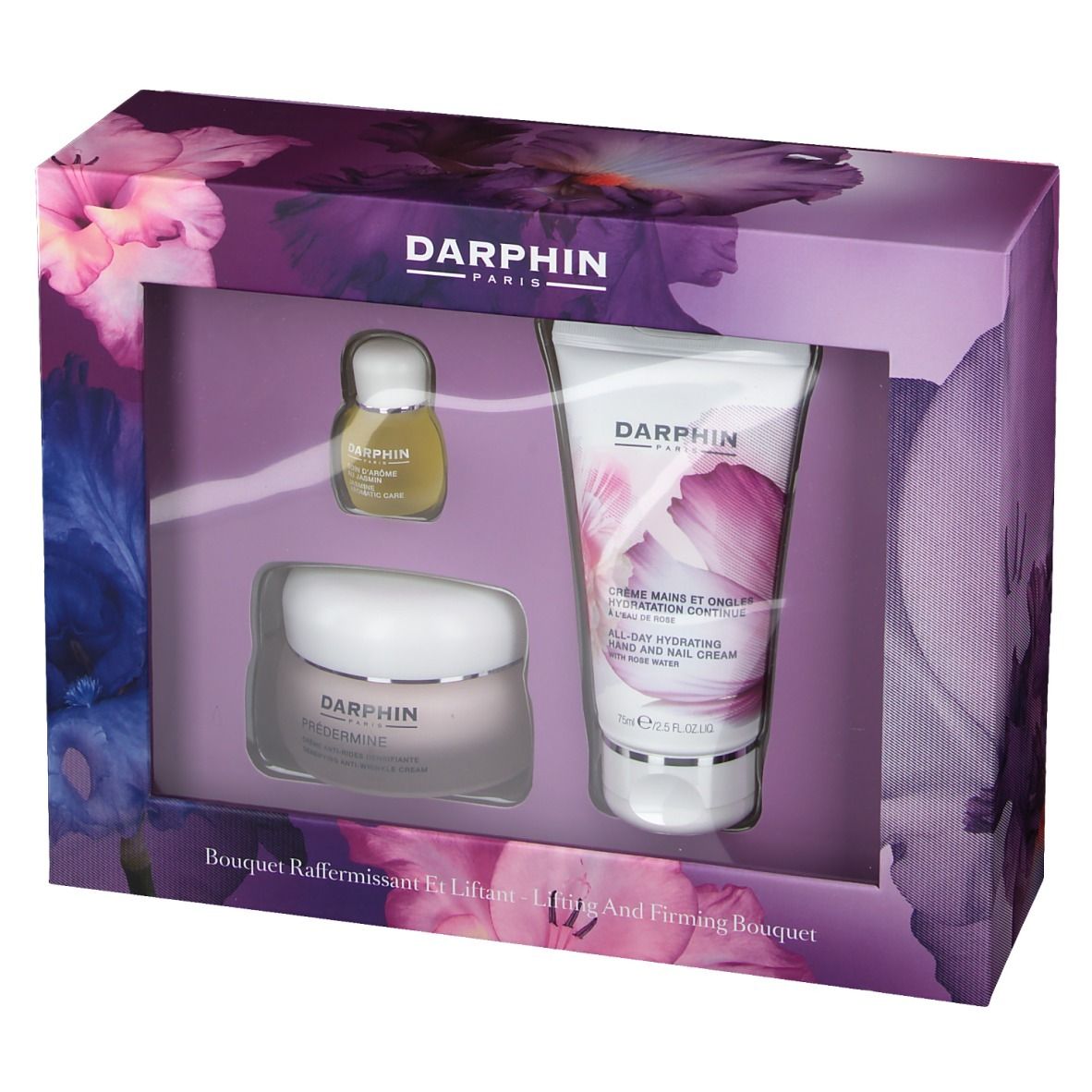 Box-Set mit drei Produkten. Enthält Creme, Serum und Handcreme. Floral bedruckt. Markenschriftzug.