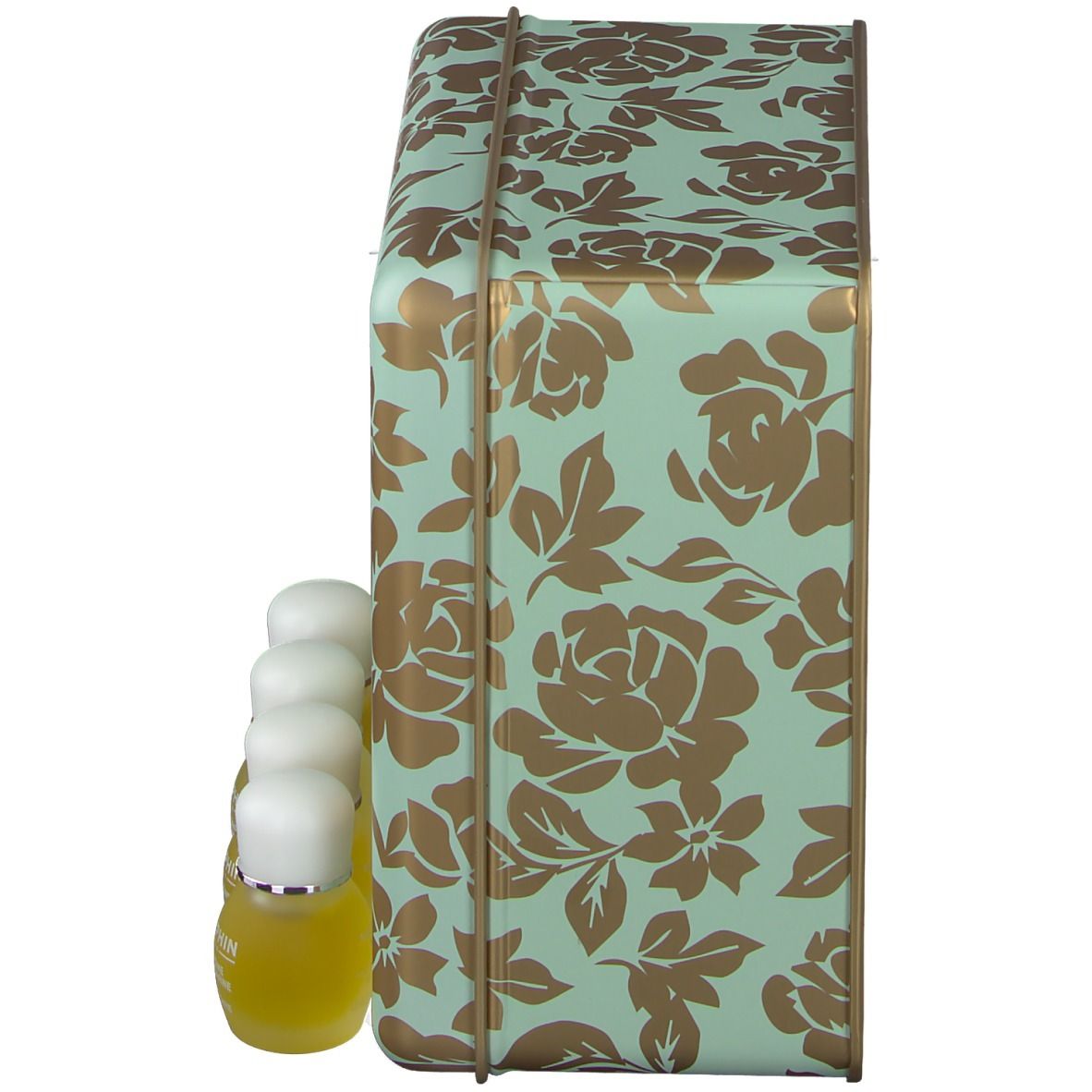 Seitenansicht der Geschenkbox. Mintgrüne Box mit goldenen Blumenmustern. Vier kleine Flaschen stehen davor.