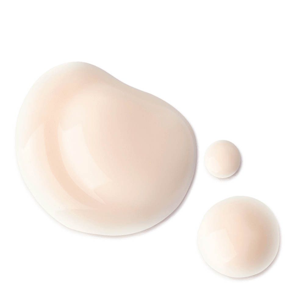 Gouttes de produit. Liquide rose clair.