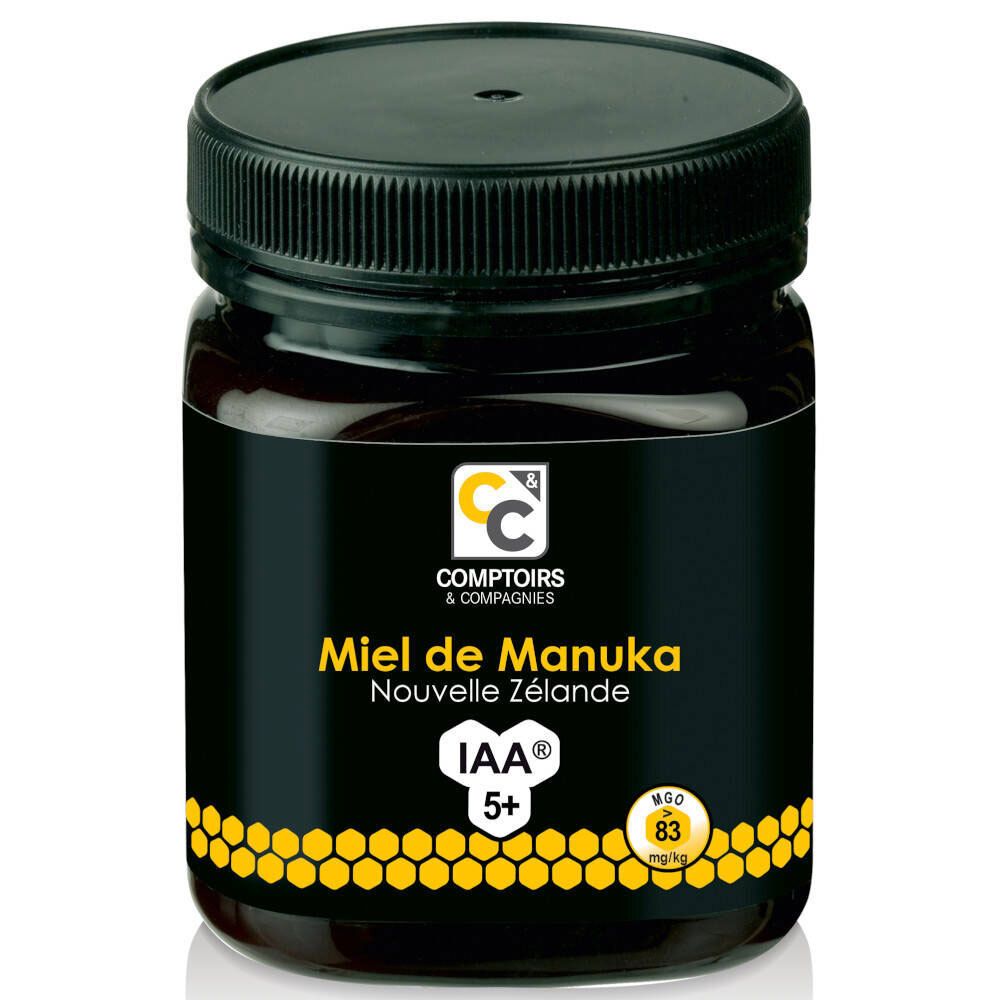 Glas mit Honig. Aufschrift: Miel de Manuka Nouvelle Zélande IAA 5+. Schwarzer Deckel und Etikett.