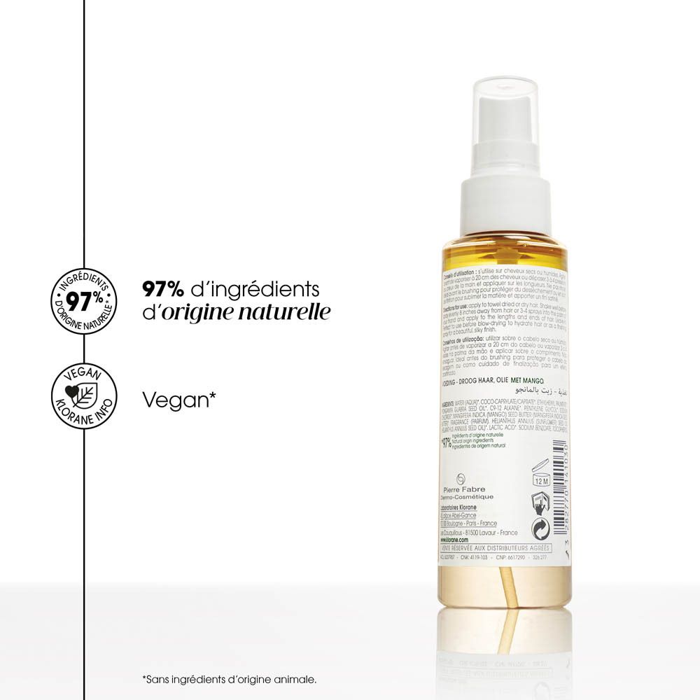 Huile Klorane à la mangue. Flacon, mangue et crème. Texte : 97% d'ingrédients d'origine naturelle. Vegan.