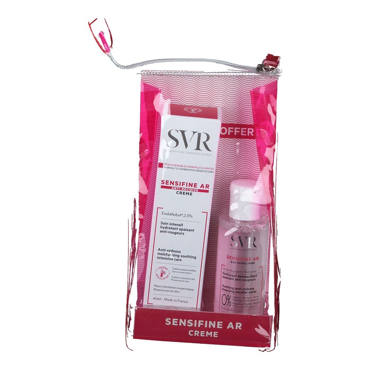 Set dans un sac transparent rose. Comprend une boîte blanche et rouge et un flacon transparent avec un bouchon blanc. Marque SVR visible.