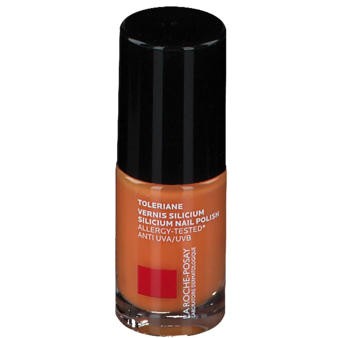 Nagellackflasche, orangefarben. Schwarzer Deckel. Text: Toleriane, Vernis Silicium, Allergy-Tested, Anti UVA/UVB. Rotes Logo.