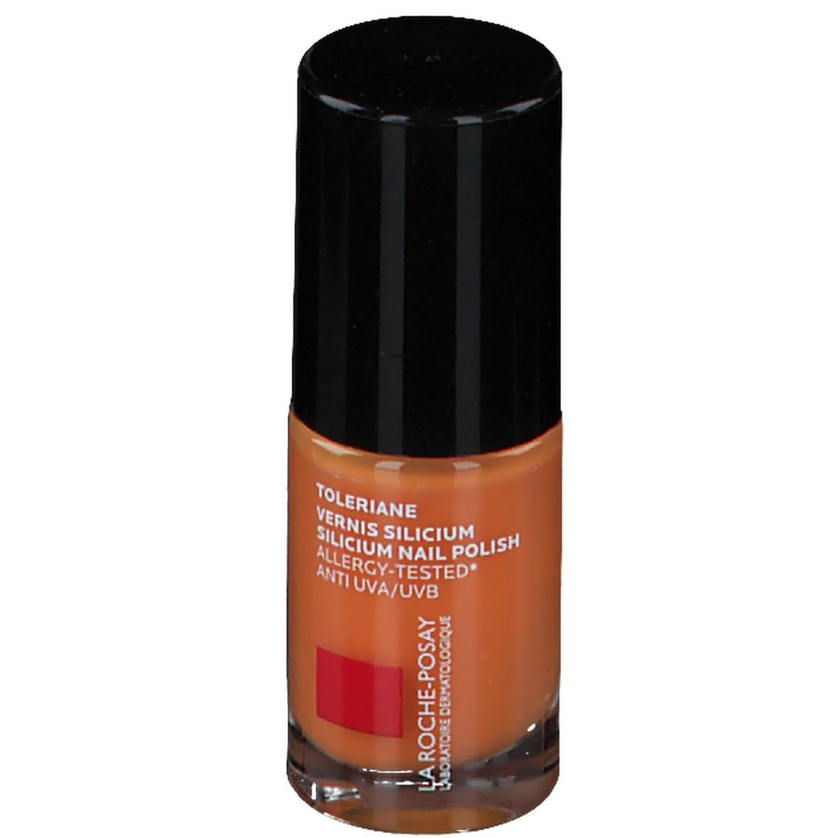 Nagellackflasche, orangefarben. Schwarzer Deckel. Text: Toleriane, Vernis Silicium, Allergy-Tested, Anti UVA/UVB. Rotes Logo.