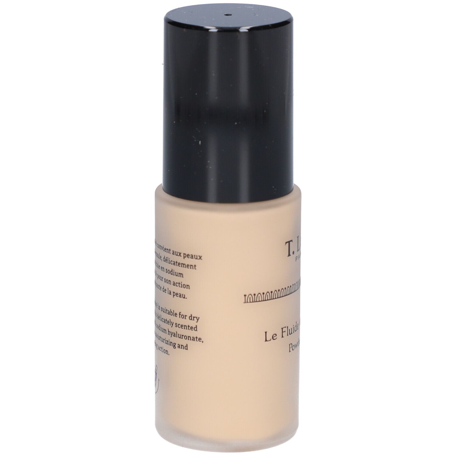 Fond de teint fluide beige dans un flacon cylindrique à bouchon noir. Texte sur le flacon.