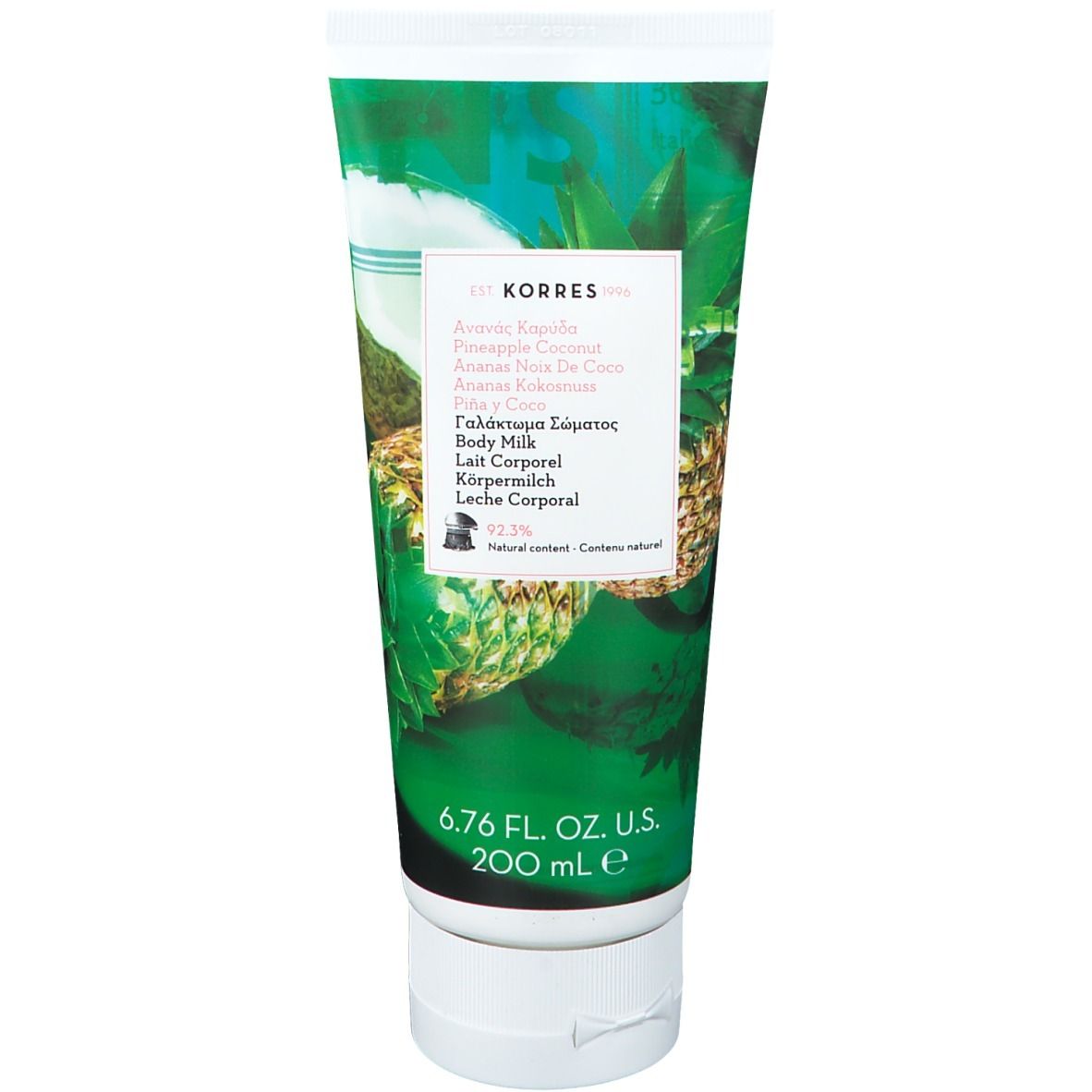 Tube de lait corporel avec motifs ananas et noix de coco. Texte multilingue, dont 'Lait corporel'.