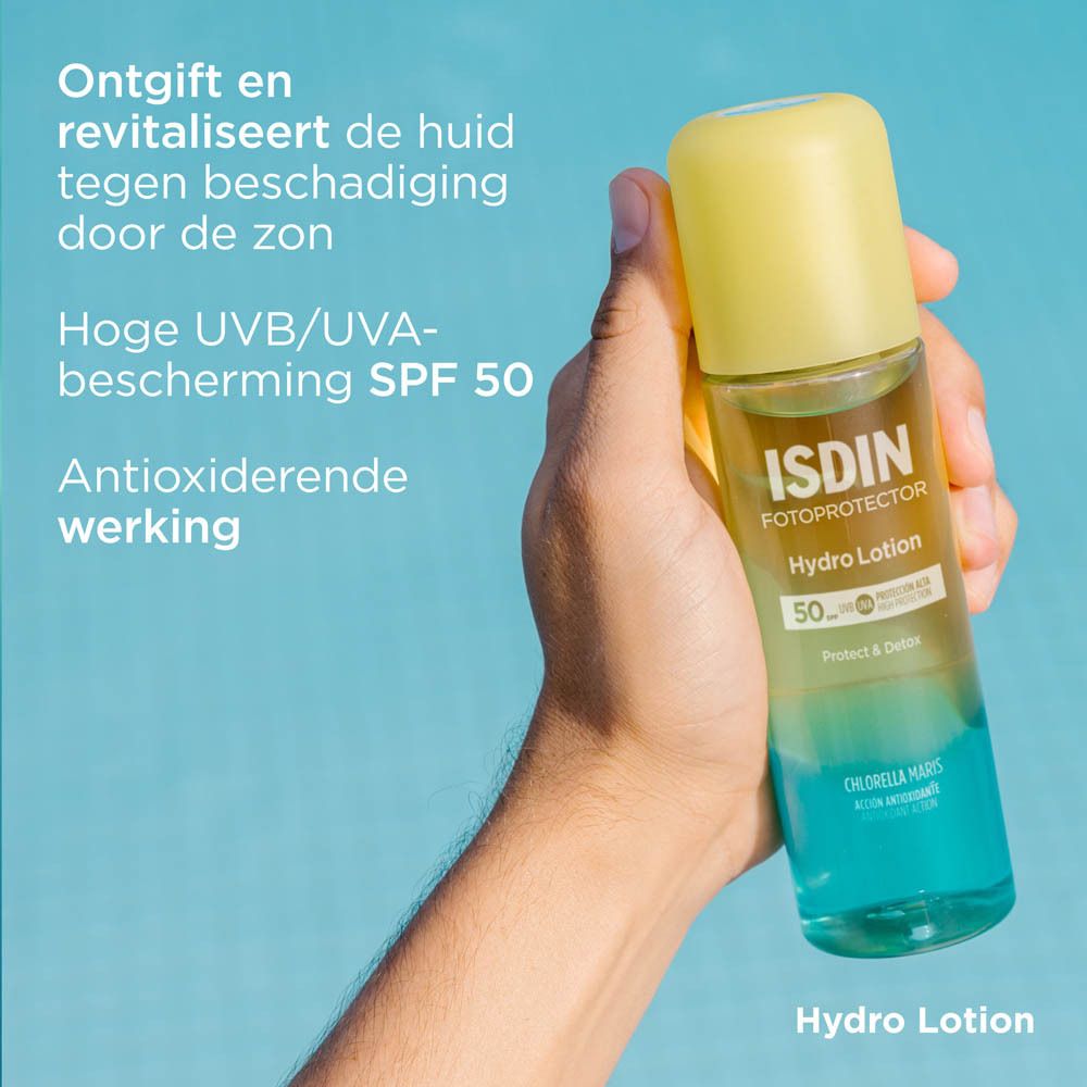 ISDIN Hydro Lotion SPF 50+ Flasche. Gelb-grüne Flüssigkeit. Hand hält sie. Text.