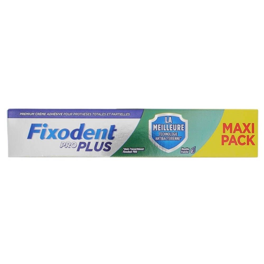 Emballage de crème adhésive pour prothèses dentaires. Emballage bleu, vert et jaune. Inscription: Fixodent Pro Plus, Maxi Pack.
