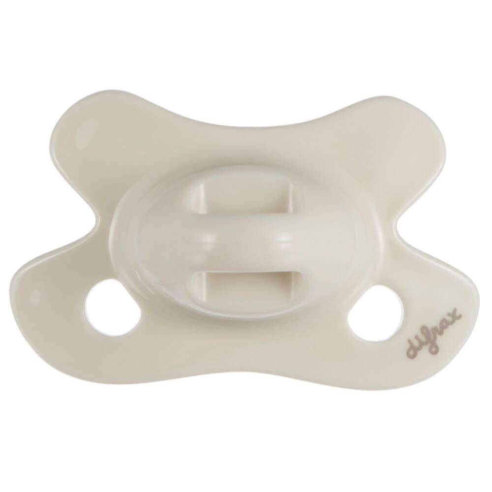 Sucette crème en forme de papillon. Deux trous sur les côtés. Marque difrax®.