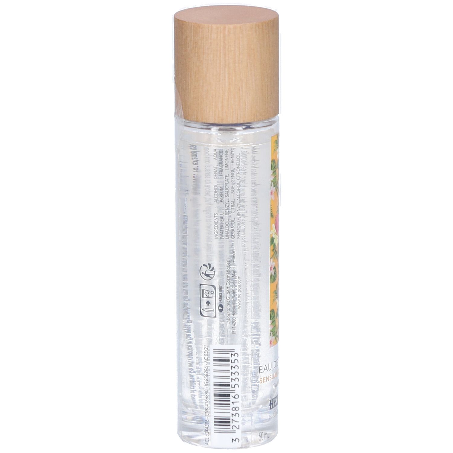 Rückansicht der zylindrischen Flasche. Holzverschluss. Gelbes Etikett mit Blumenmuster. Text und Barcode. Transparente Flüssigkeit sichtbar.