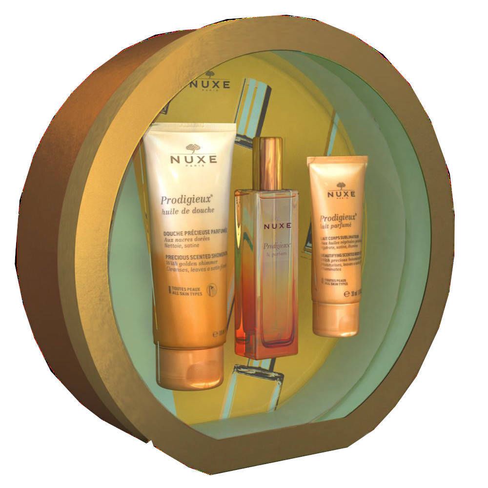 Geschenkset Nuxe Prodigieux®. Rundes Set mit drei Produkten: Duschgel, Parfum, Körperlotion. Goldfarbene Verpackung.