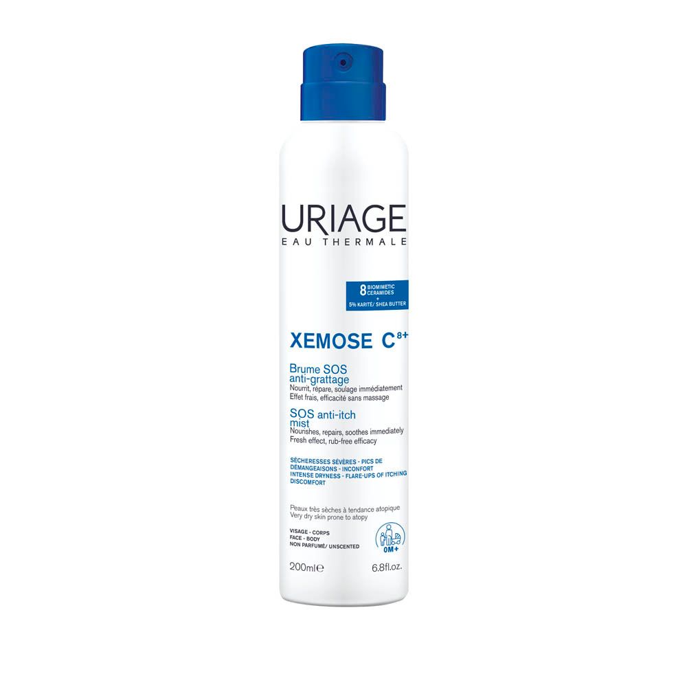 Weiße Sprühflasche mit blauem Deckel. URIAGE Xémose C++. Text.