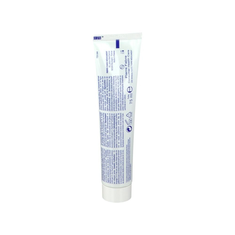 Dos du tube de dentifrice ELGYDIUM. Texte en bleu. Informations du fabricant et ingrédients.