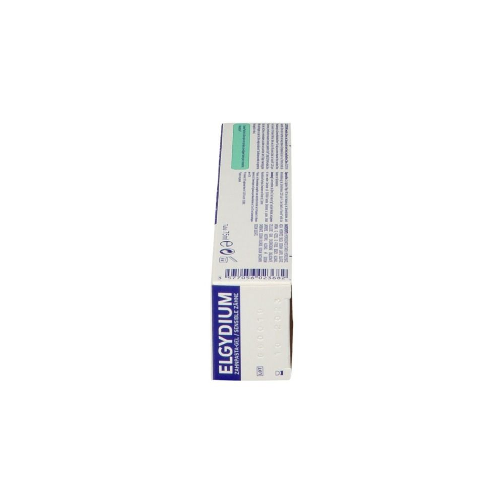 Côté de la boîte de dentifrice ELGYDIUM Sensitiv. Bleu, blanc. Texte et symboles.