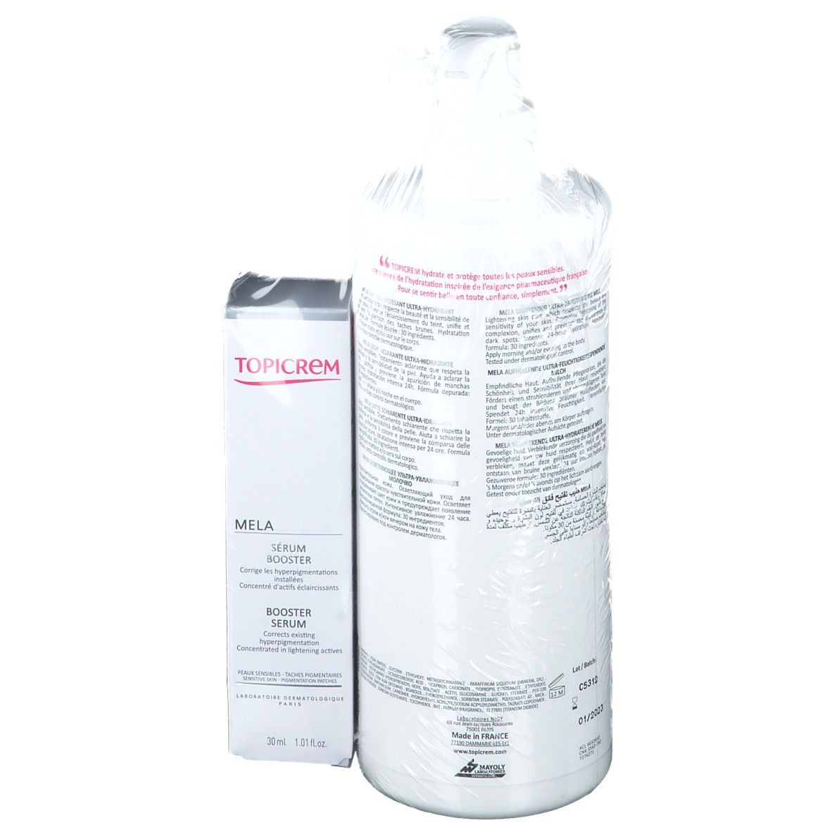 Sérum et lotion TOPICREM MELA. Dos du sérum et de la bouteille avec texte. Emballé dans du film plastique.
