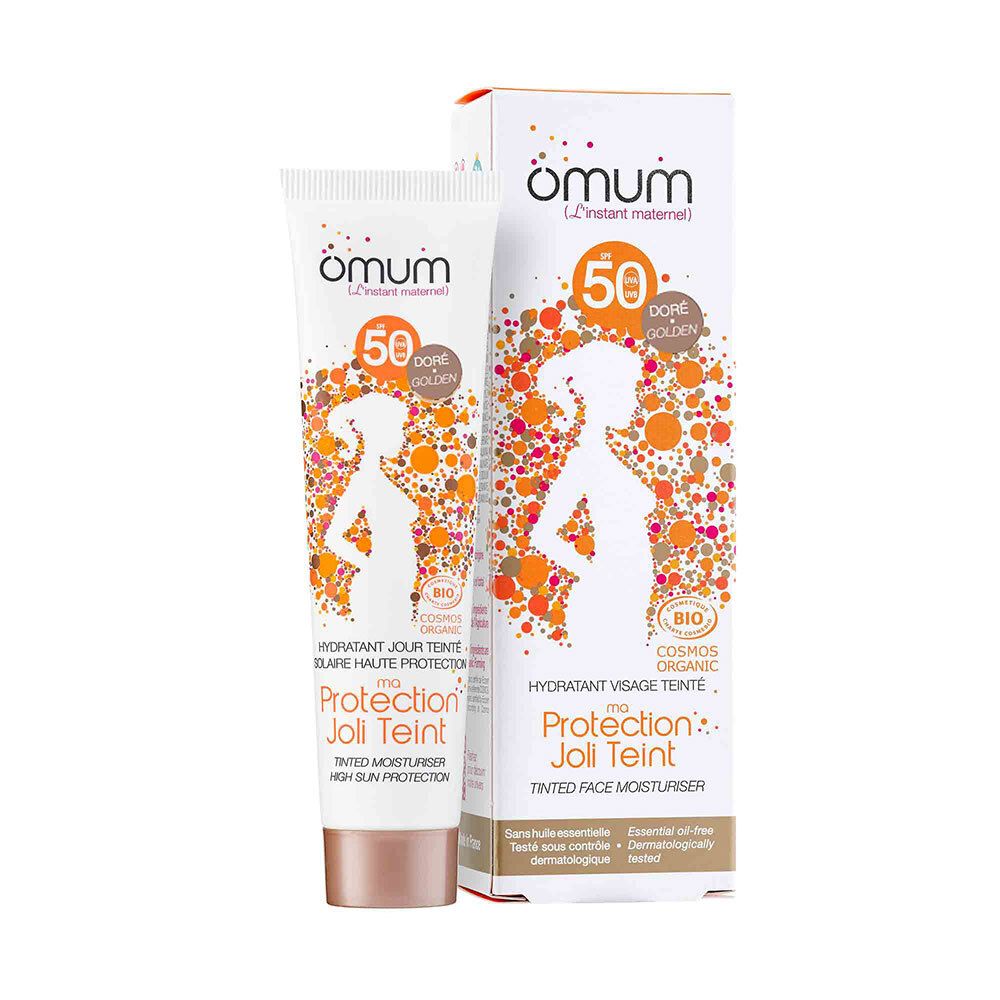 Tube de crème hydratante teintée. Marque Omum. Couleur dorée. SPF 50. Certification bio.