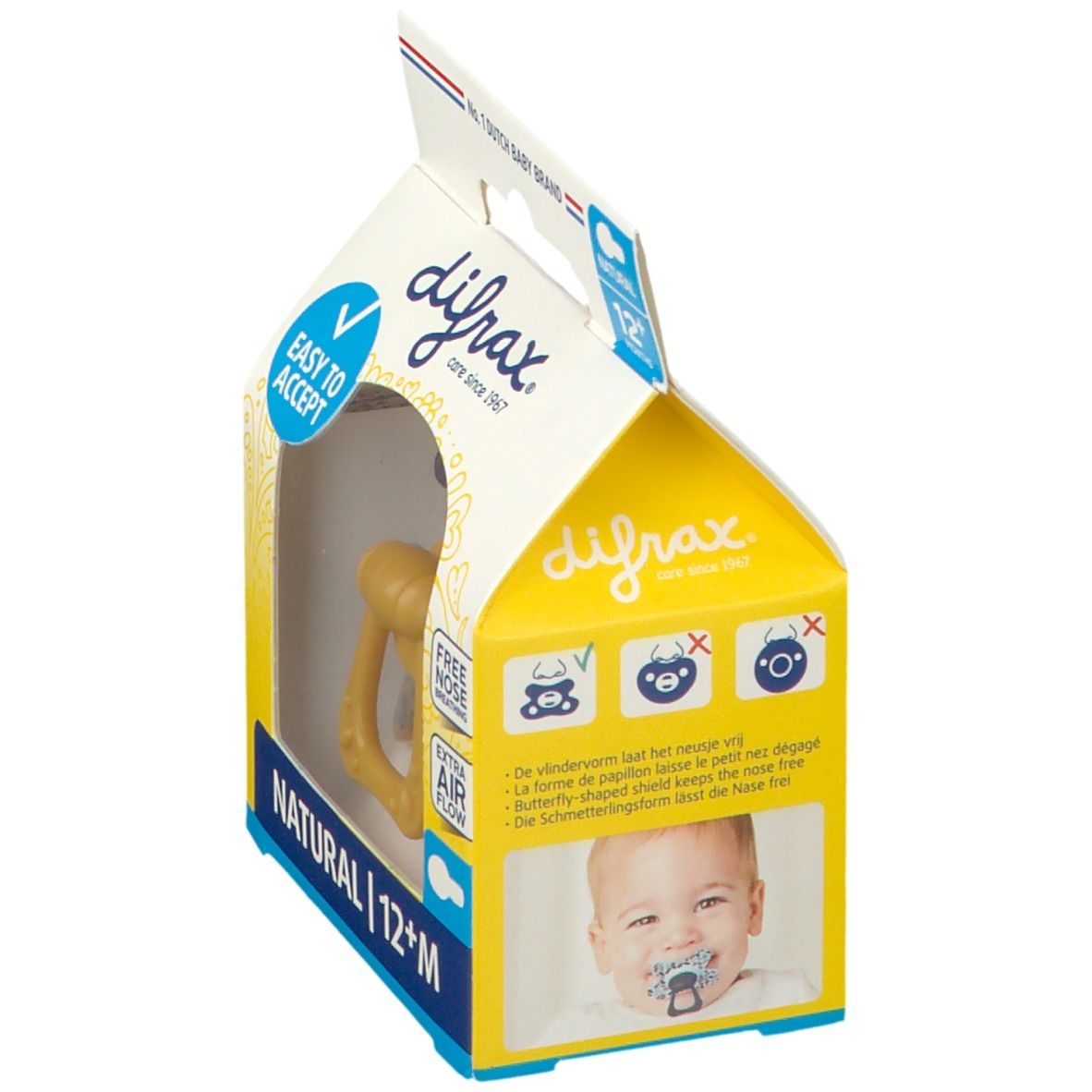 Emballage de sucette. Sucette jaune avec poignée. Texte: NATURAL 12+M, EASY TO ACCEPT, FREE NOSE BREATHING, EXTRA AIR FLOW. Bébé avec sucette.