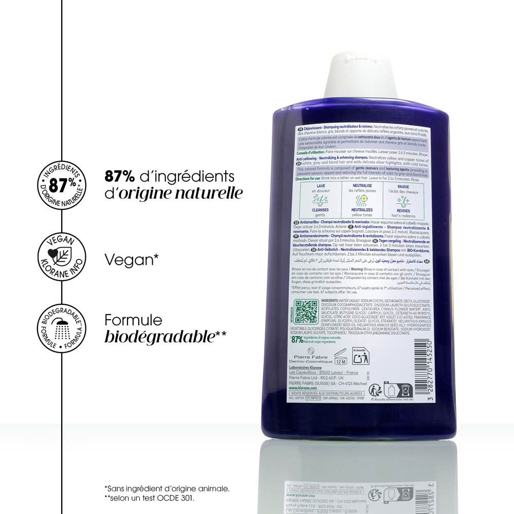 Dos du flacon de shampooing. Texte : 87% d'ingrédients naturels, vegan, formule biodégradable.
