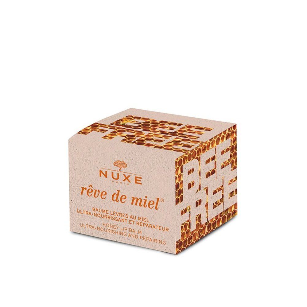 Emballage du baume à lèvres Nuxe Rêve de Miel avec motif alvéolé et inscription "Bee Free".