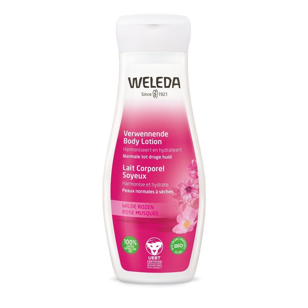 Weleda Body Lotion Flasche. Weißer Deckel, rosa Etikett mit Text und Logo. Zertifizierungen unten.
