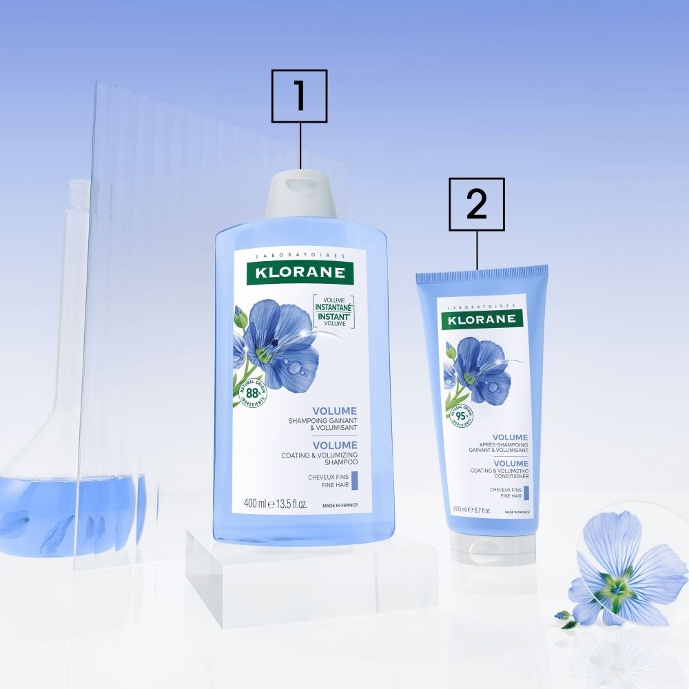 Bouteille de Shampooing Klorane BIO Lin Volume avec illustration de fleurs de lin et mention 'Volume, Shampooing gainant & volumisant'.