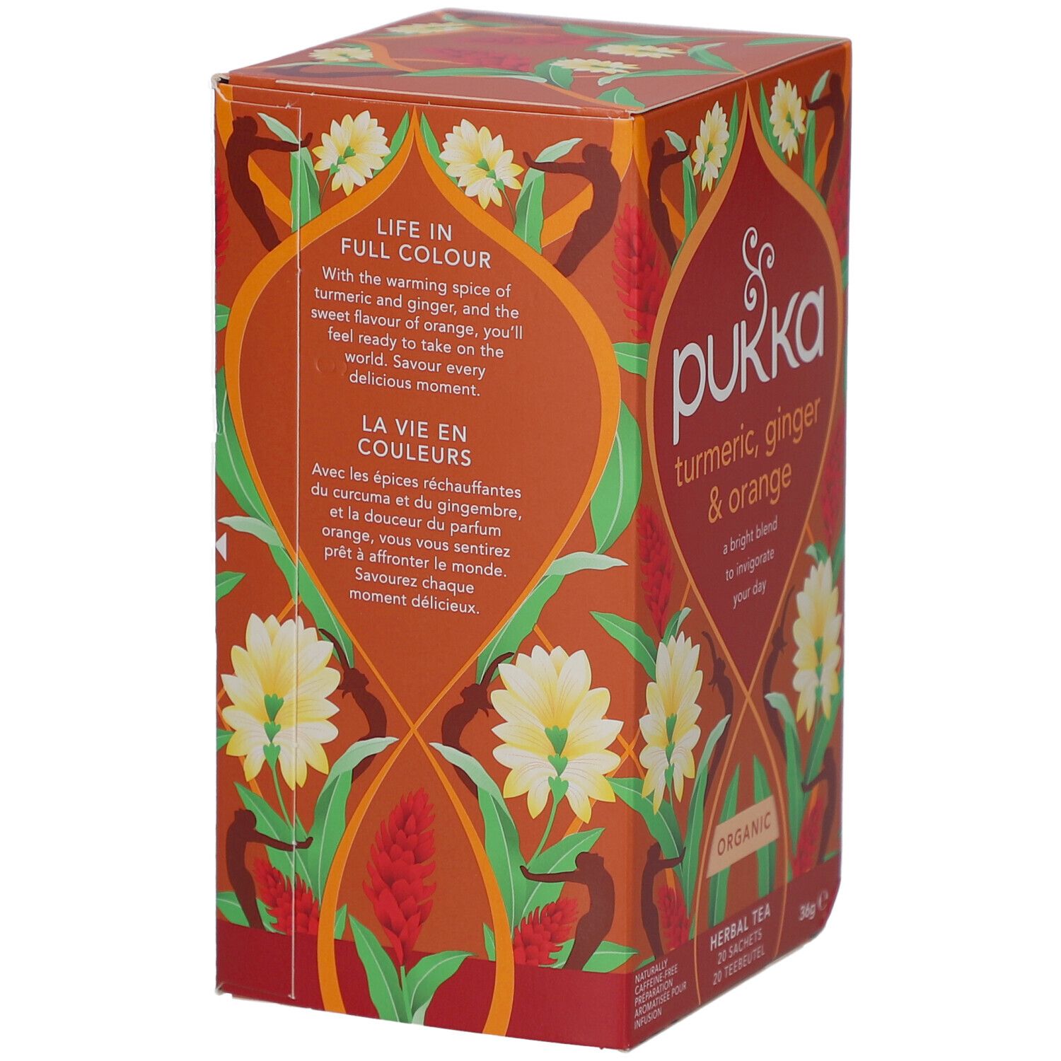 Pukka-Verpackung mit Aufschrift "turmeric, ginger & orange". Orangefarbenes Design mit floralen Elementen.
