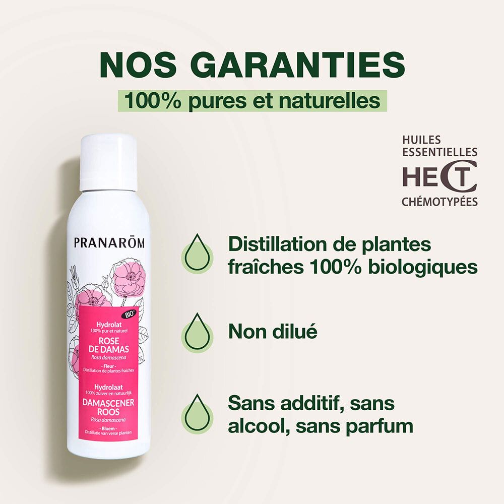 Flacon spray blanc, étiquette rose. Texte: PRANAROM, Rose de Damas, Hydrolat. 100% pur et naturel.