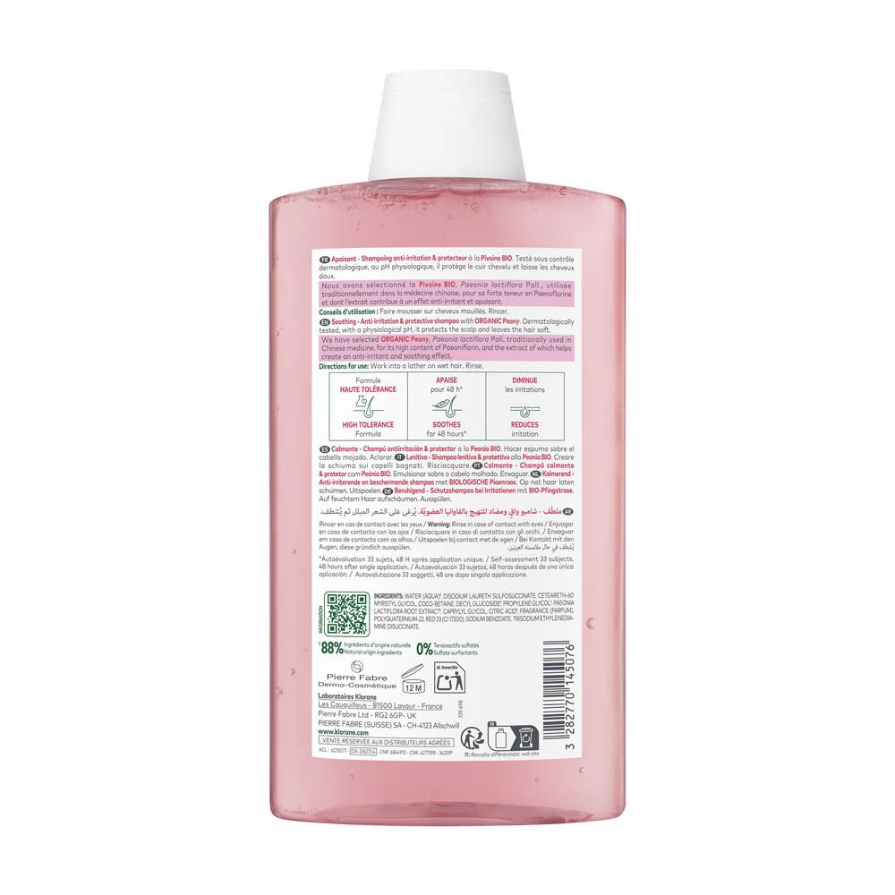 Flacon de shampooing rose. Texte avec informations produit. Fleur rose. Texte: Klorane, Apaisant, 48h d'apaisement.