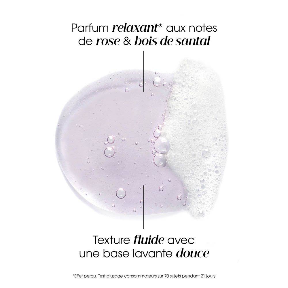 Dos d'un flacon de shampooing rose. Texte avec informations produit. Certifications et logos.