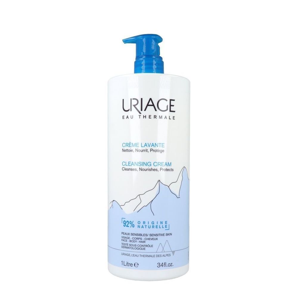 Flacon de crème lavante Uriage. Blanc, pompe bleue. Texte: Uriage, Crème Lavante, 92% ingrédients naturels.