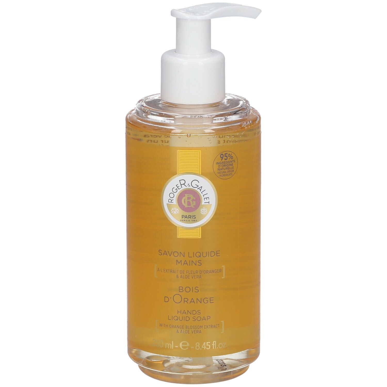 Flüssigseife mit Spender. Klarer Behälter mit gelber Flüssigkeit. Aufschrift: Savon Liquide Mains, Bois d'Orange, 95% Inhaltsstoffe natürlichen Ursprungs.