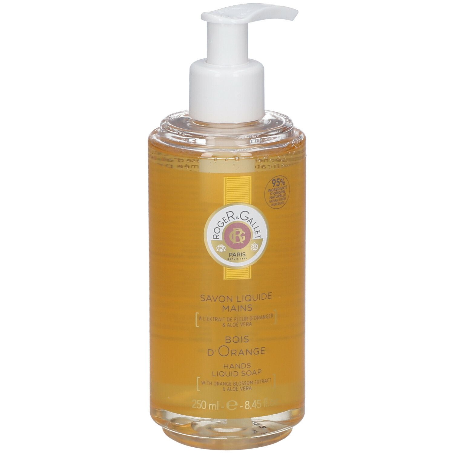 Flüssigseife mit Spender. Klarer Behälter mit gelber Flüssigkeit. Aufschrift: Savon Liquide Mains, Bois d'Orange, 95% Inhaltsstoffe natürlichen Ursprungs.