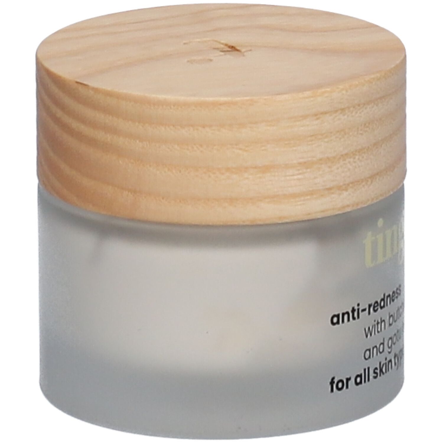 Tinge Anti-Rötungs-Creme in einem Glasbehälter mit Holzdeckel.