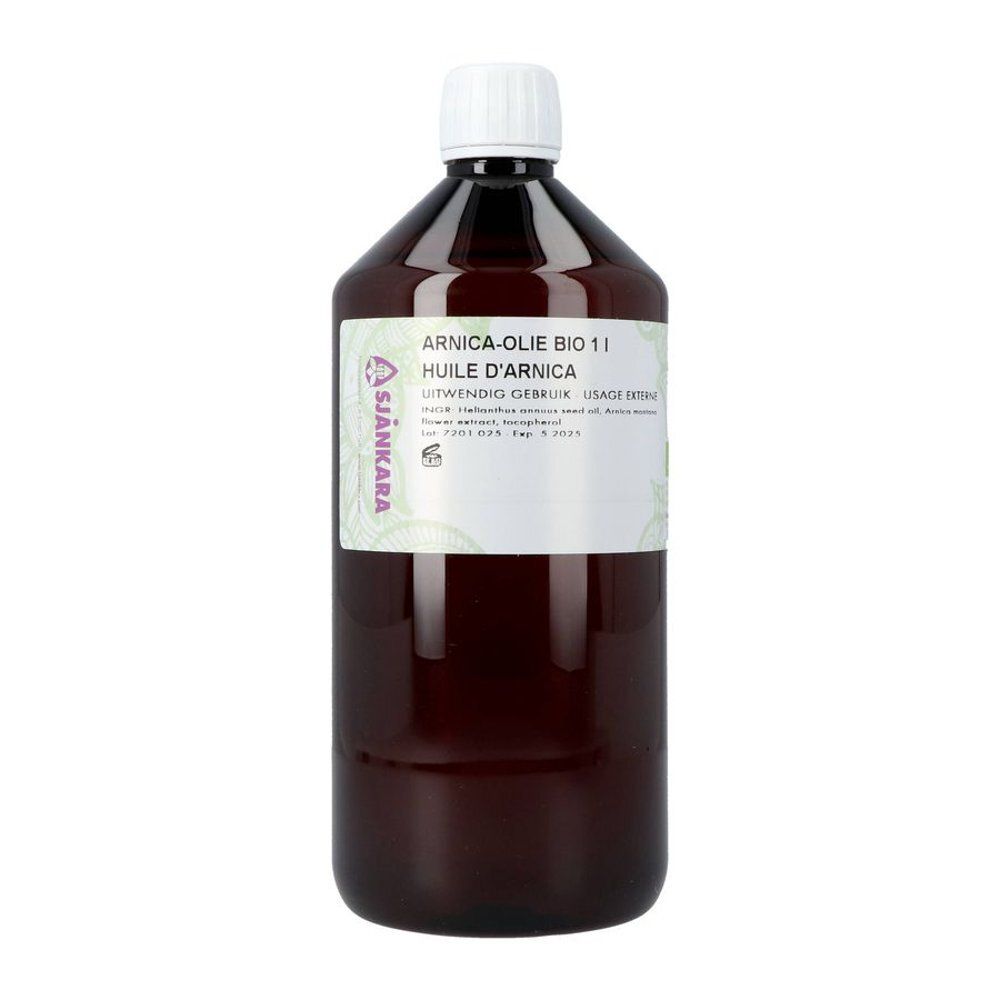 Sjankara Arnicaöl 100ml in dunkler Glasflasche mit schwarzem Verschluss und bedrucktem Etikett, daneben die Verpackung.